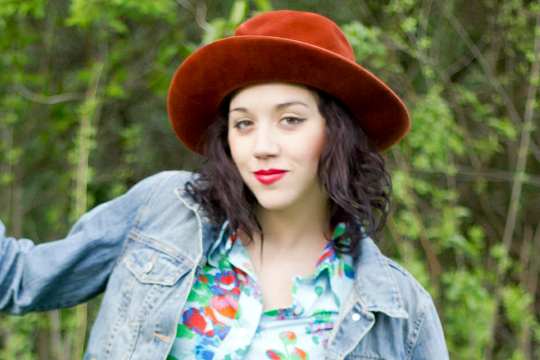 photographer modern day flapper wears a vintage men's hat