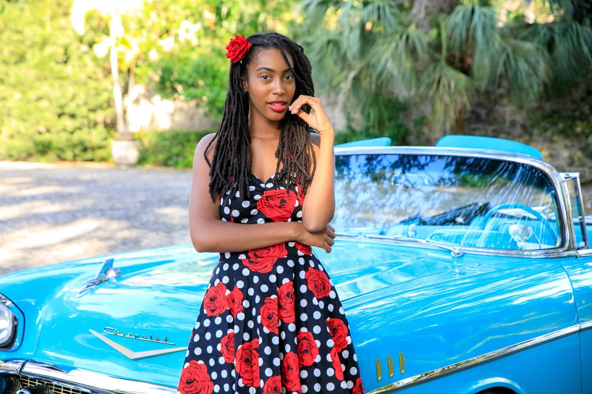 Free Woman in Floral Dress Standing near Blue Car Stock Photo