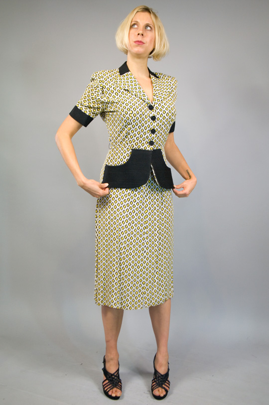 a 1940s suit style one piece dress