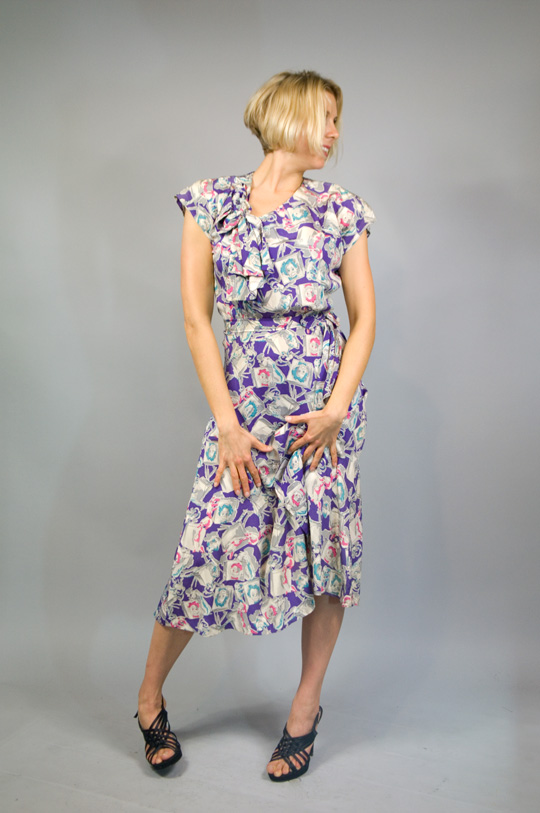 a 1940s novelty print rayon dress with clown character design