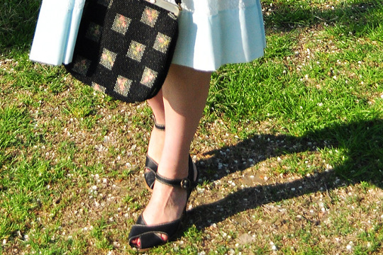 black shoes and black vintage bag